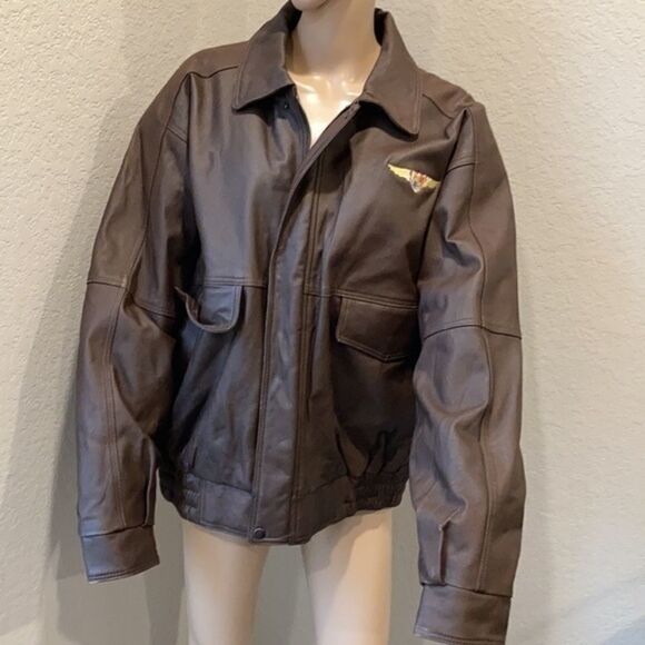 Burks Bay  leather brown coat has a patch on the left side. - Picture 2 of 8